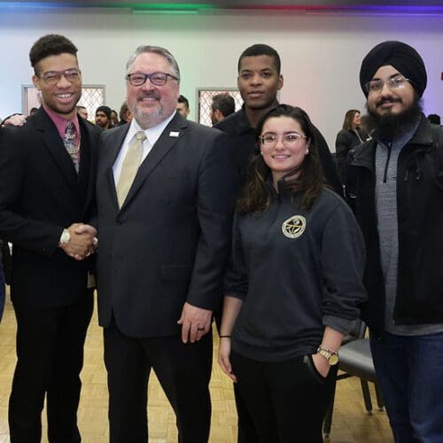 2023-24 PNW Student Government Association members pose for a photo with PNW Chancellor Chris Holford during the Excellence Evolving leadership celebration.