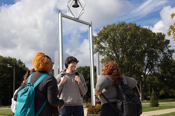 PNW students stand in front of the Bell Tower
