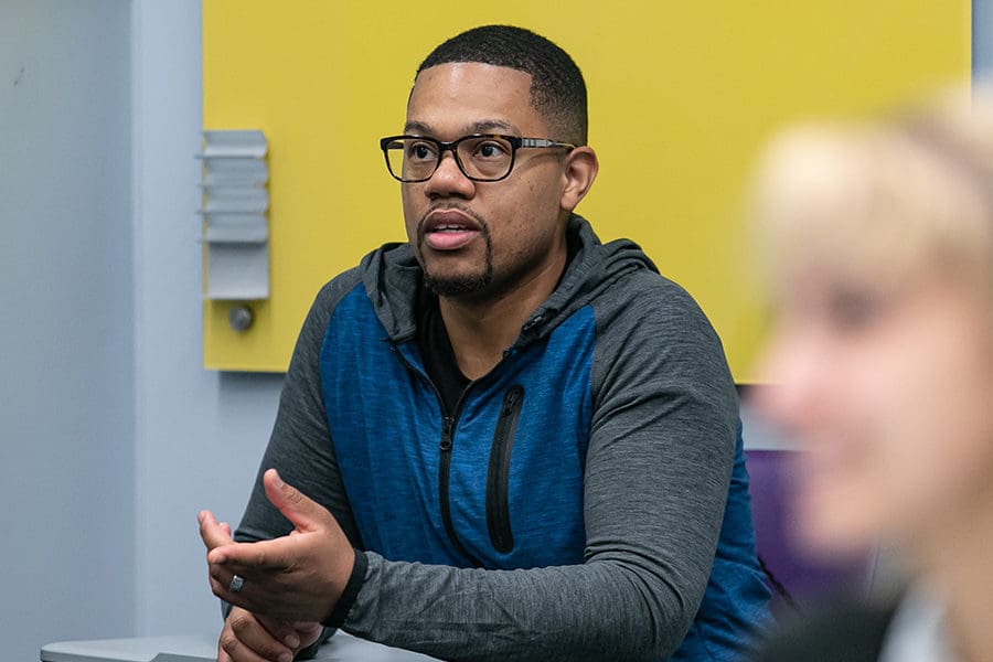 Male student speaking in class