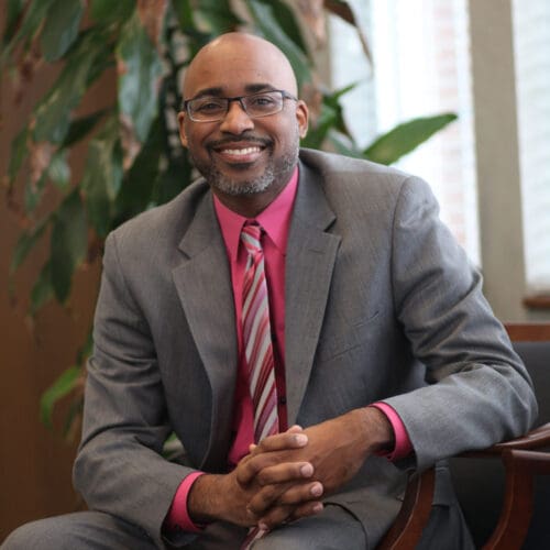 Purdue University Northwest (PNW) Clinical Associate Professor of Business Law Shontrai D. Irving was honored Tuesday, July 28 with the Sagamore of the Wabash award for his career as an attorney, involvement with the local community and academics, and role as a foster parent. The Sagamore of the Wabash is one of the highest civilian honors bestowed by the sitting Indiana governor in recognition of service to the state or the governor. Irving was recognized during a reception by the Lake County Bar Association at the Hellenic Cultural Center in Merrillville. “Shontrai is a very intelligent and charismatic person who has a great sense of service and leadership,” said Ind. State Rep. Vernon Smith, who nominated Irving for the award. “He’s committed to reaching back and helping others. Shontrai is also probably one of the most inviting professors I’ve run across. He knows how to connect with his students, engage them, and build relevance and rigor into the classroom.” Since 2006, Irving has served as either a foster parent or respite for more than 40 children. “I’m super humbled and honored to be a recipient,” said Irving. “I’m aware of Hoosiers and other distinguished leader who have received this honor. It means a lot to be in that company and be recognized by Gov. Holcomb in that respect.” Irving has taught at PNW’s College of Business since 2014. His coursework focuses on areas including business law, litigation, ethics, justice, and courts. He likes to take his students to join him in courtrooms to see real-life examples of case arguments. He has also helped bring “Appeals on Wheels” to PNW for the campus community to observe Indiana Court of Appeals judges. Irving earned his Master of Business Administration (MBA) from PNW. He earned bachelor’s degrees in Criminal Justice and Afro-American Studies, a master’s degree in Criminal Justice, and a Doctor of Jurisprudence degree from Indiana University Bloomington. Irving was recognized at PNW’s 2022 Founders Day program for the Outstanding Faculty Engagement award. He also served as a Scholarship of Engagement Fellow during the 2020-21 academic year. “I am thrilled that Professor Irving is being recognized with this distinguished honor,” said Rachel Clapp-Smith, interim dean of the College of Business. “He is truly a servant leader, who brings his whole self to everything he does. I believe most would agree that his genuine and generous way of interacting students, colleagues, clients, and community partners puts everyone at ease and invites authentic dialog.” Outside of PNW, Irving is a public defender in the Lake County juvenile court system, an associate with Semko Law in Schererville, and an active member of the Lake County, Indiana State, and Kimbrough Bar associations.