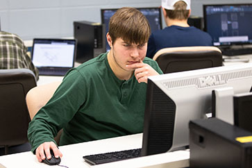 A PNW student works in a computer lab