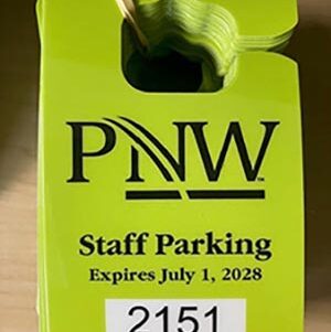 A green PNW parking hang tag with text: PNW Staff parking expires July 1, 2028.