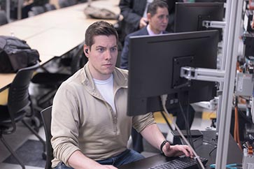 PNW student working on a computer in an engineering classroom 363x242