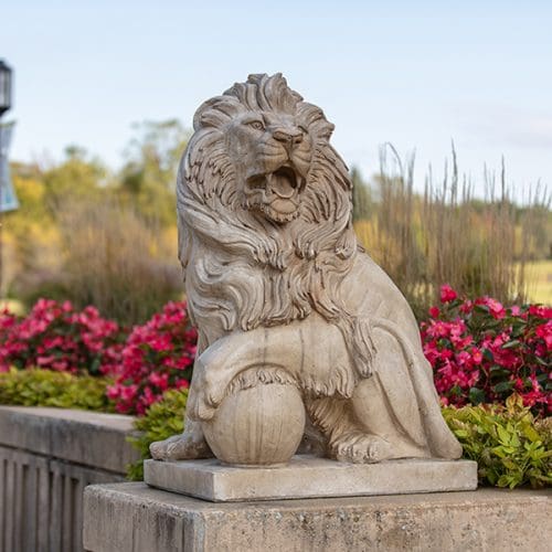 Logo: 5•75 Purdue University Roaring Ahead with an illustration of a striding lion.