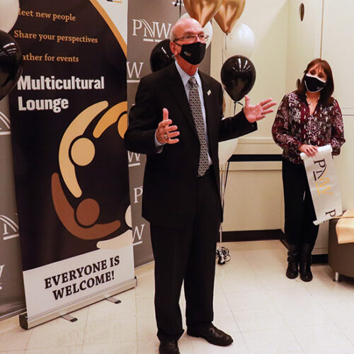 Purdue University Northwest Chancellor Thomas Keon briefly speaks at an open house for the new multicultural lounge in Classroom Office Building Room 180.
