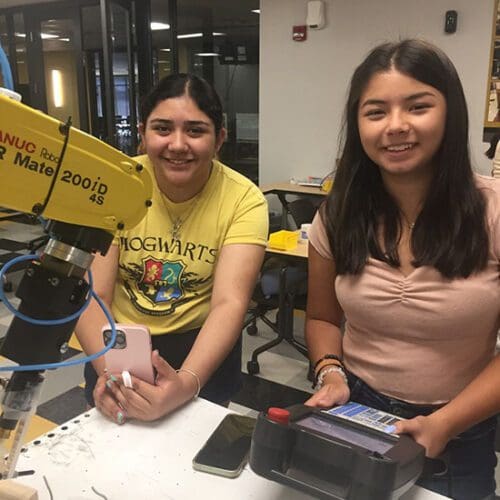 Students work with equipment at a PNW robotics camp