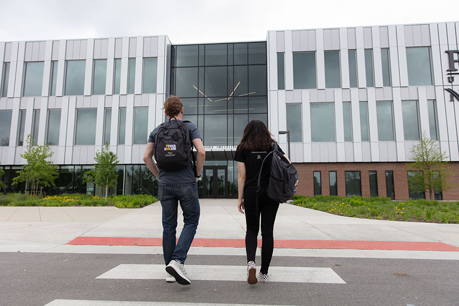 Two students walk toward the Nils K. Nelson Bioscience and Innovation Building