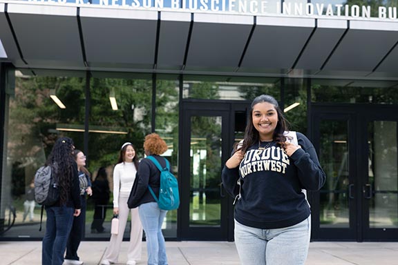 PNW students stand in front of the Nils K. Nelson Bioscience Innovation Building.