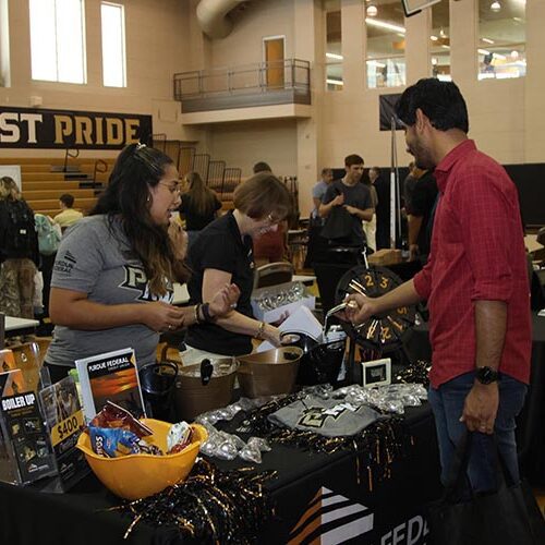 Westville Welcome Rally - students looking at the organization tables 750x500