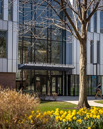Spring view of the entrance of the Nils K. Nelson Bioscience Innovation Building
