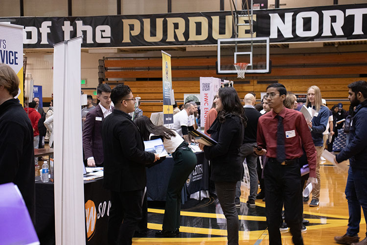 The PNW 2024 Spring Career Expo is a career fair for students and alumni of Purdue University Northwest that are seeking full-time employment and internships across all industries and academic majors. Vistors stroll through the Career Expo at Purdue University Northwest in the Fitness and Recreation Center building