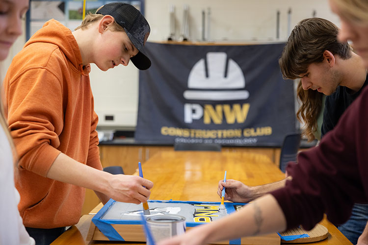 Students in the PNW Construction Club work on a project