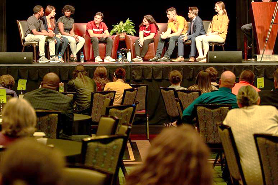 Students on the podium at a Continuing Education event