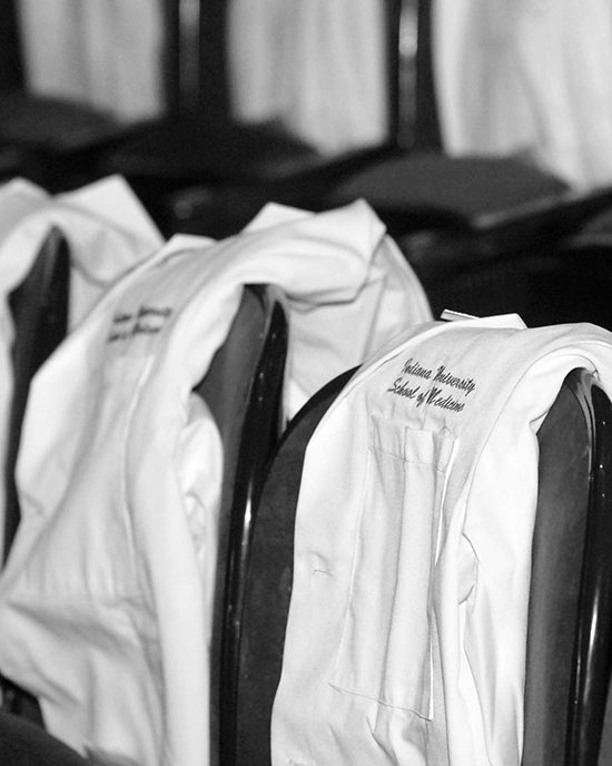 Medical student lab coats lined up