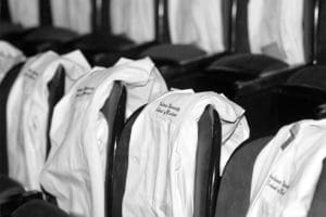 Medical labcoats in line at graduation