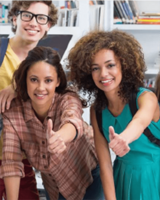 A group of students gives a thumbs up