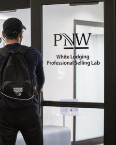Student entering the White Lodging Professional Selling Lab