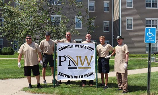 PNW Police Officers pose together during the 2022 Cookout with a Cop event