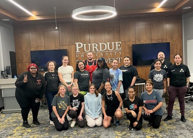 Attendees pose together during a "fight like a girl" training.