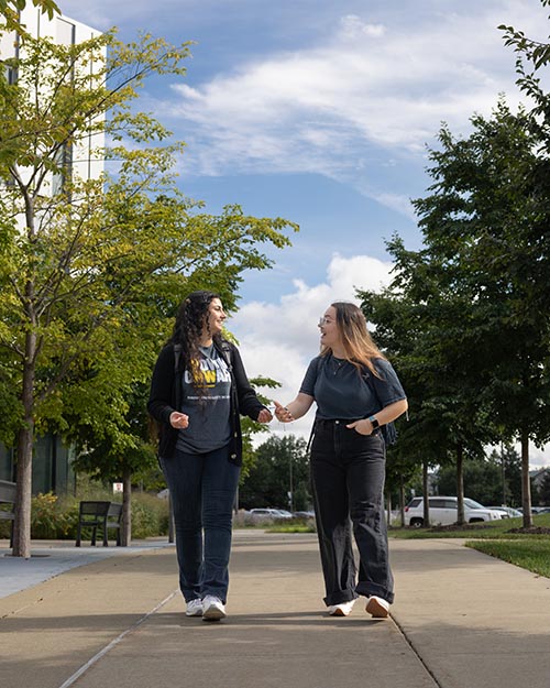 Two PNW students walking on campus