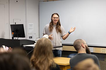 PNW student presenting in front of the class 363x242