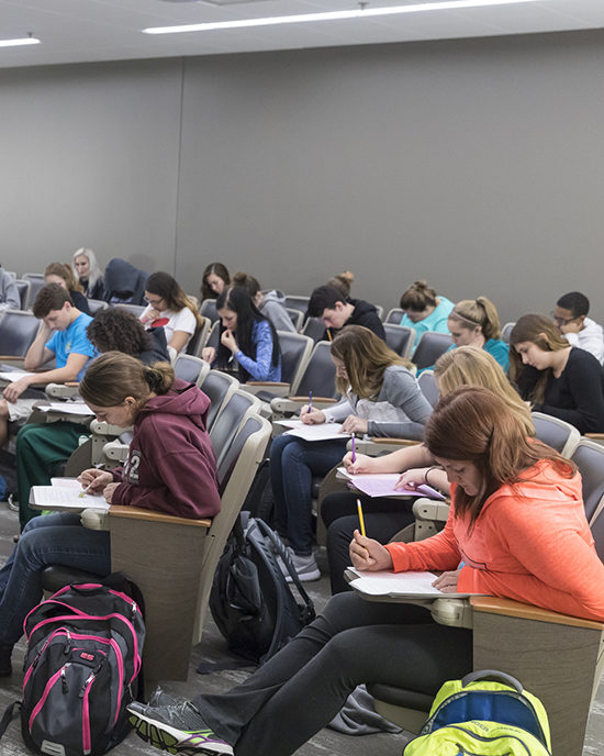 Students take a test in the classroom.