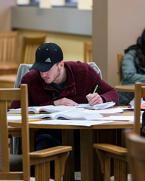 student taking notes