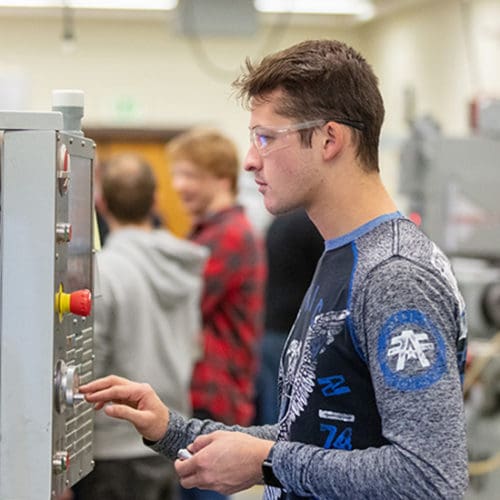 A PNW student does research in the lab.