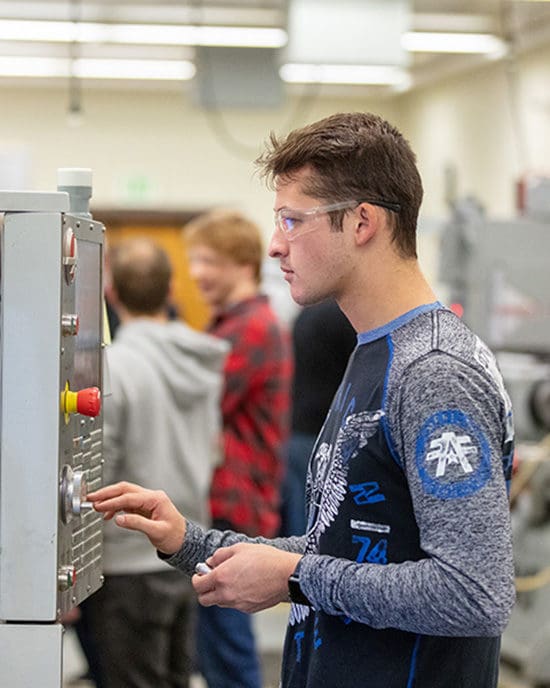 A PNW student does research in the lab.