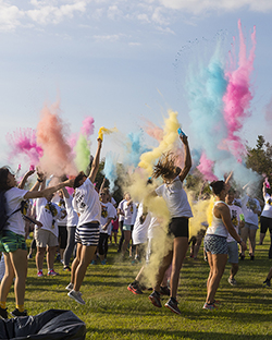 Students kick off the Pride Stride with a spray of color.