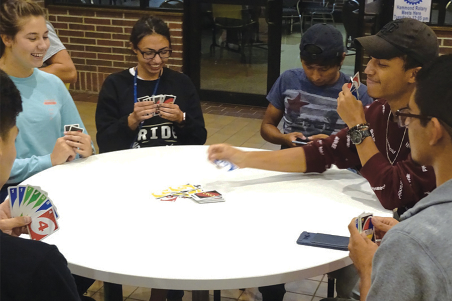 Students playing Uno