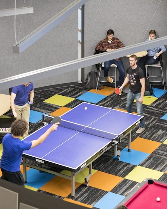 Students playing ping pong.