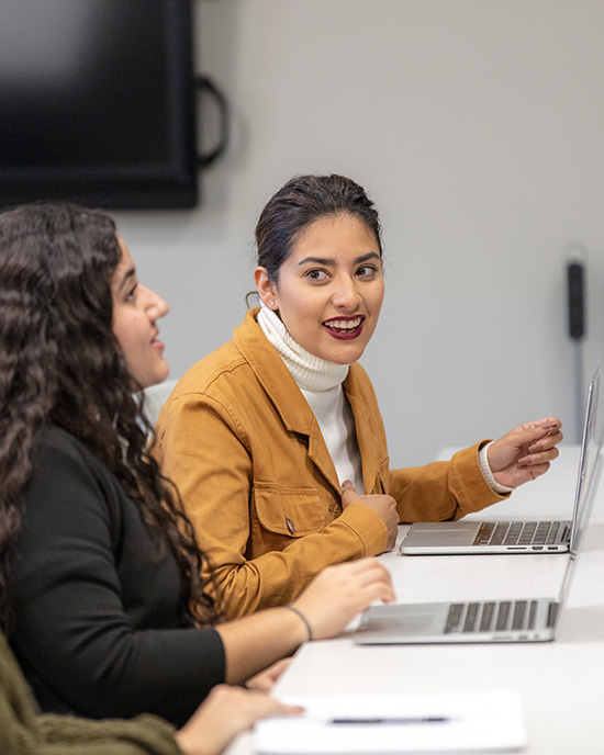 Students talking are pictured.