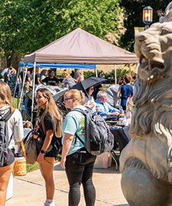 Students gather outdoors for a welcome rally on the Westville campus