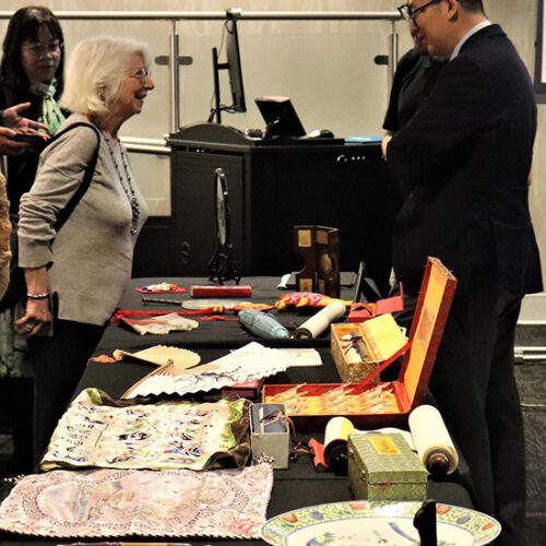Tao Wang, Pritzker Chair of Arts of Asia, executive director of initiatives in Asia, and curator of Chinese art at the Art Institute of Chicago, right, shares information about PNW’s archive items from China.