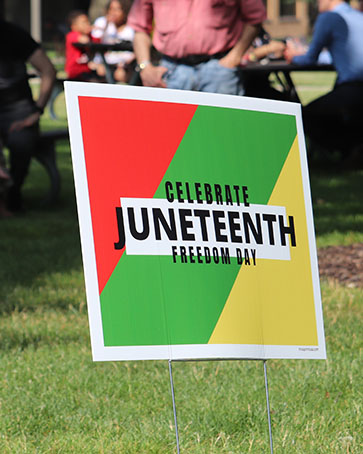 A yard sign that reads "Celebrate Juneteenth: Freedom Day"