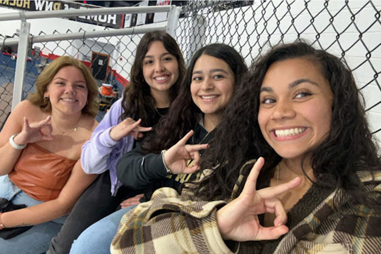 PNW Gammas enjoy a day out together at a game.