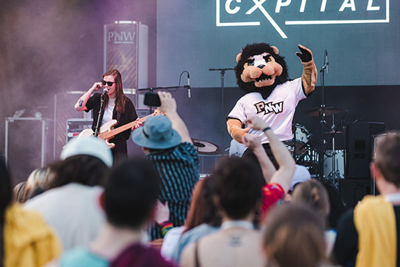 Cxpital on stage with Leo the Lion