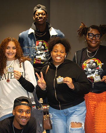 Five students pose together during the Black History Month Launch Party