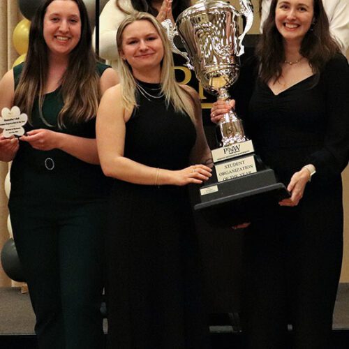 Students pose with their "Student Organization of the Year" trophy during the Chancellor's Ball