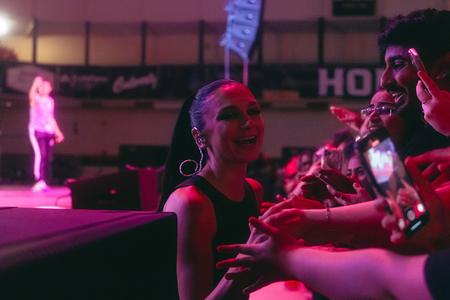 Roaring Loud Concert 2025 - Daya high-fiving students in the crowd