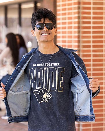 A student shows off his PNW Pride t-shirt