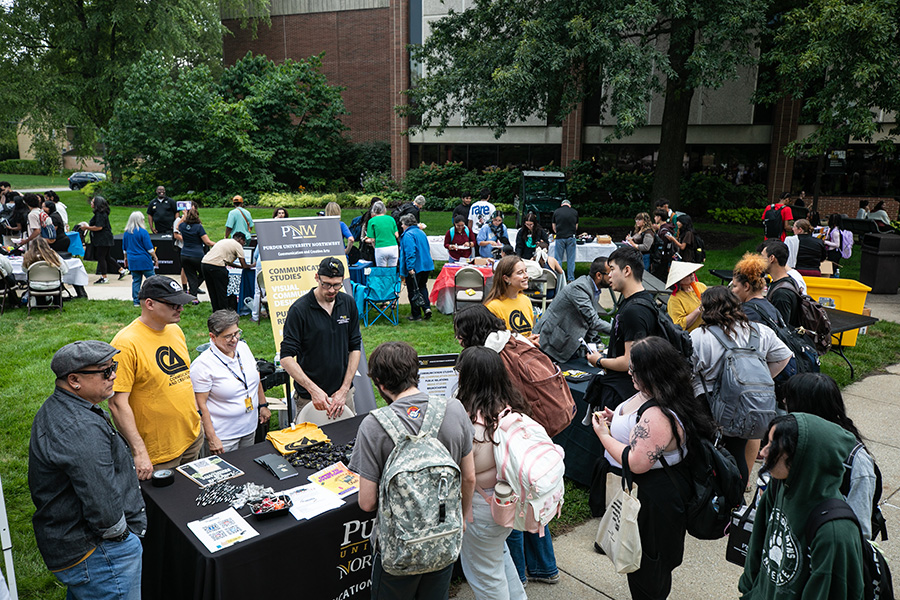 Fall 2025 Welcome Rally, students talking with the CCA department table