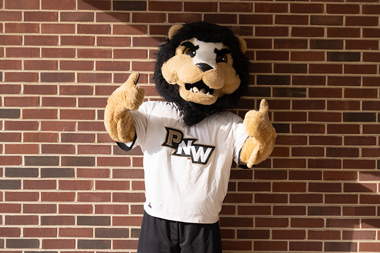 PNW mascot Leo the Lion holds up two thumbs-up