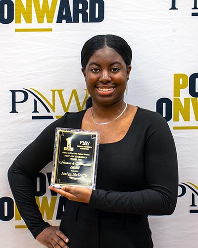 Jaelyn McDuffie with the PNW Golden Brick Award
