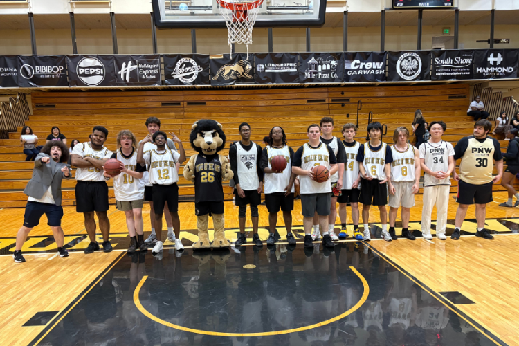 Photo on basketball court of students at the Battle of the Orgs event