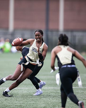 PNW Women's Flag Football team playing at the Homecoming Sports Fest