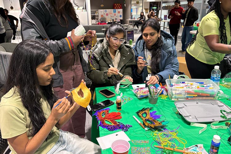 PNW students come together for Mardi Gras event while decorating masks