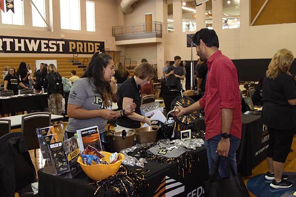Westville Welcome Rally - students looking at organization tables