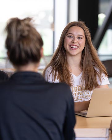 PNW students collaborate together in a student lounge.